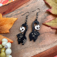 Wood Engraved Black Kitties Holding Ivory Skull Earrings